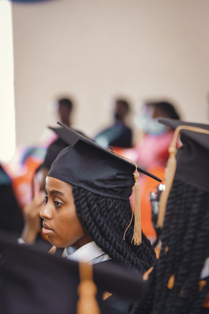 African university graduates in caps and gowns at a graduation ceremony in Nairobi, Kenya