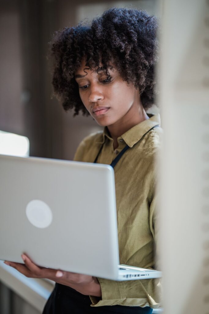 Woman in Africa working on AI training jobs from home on a laptop