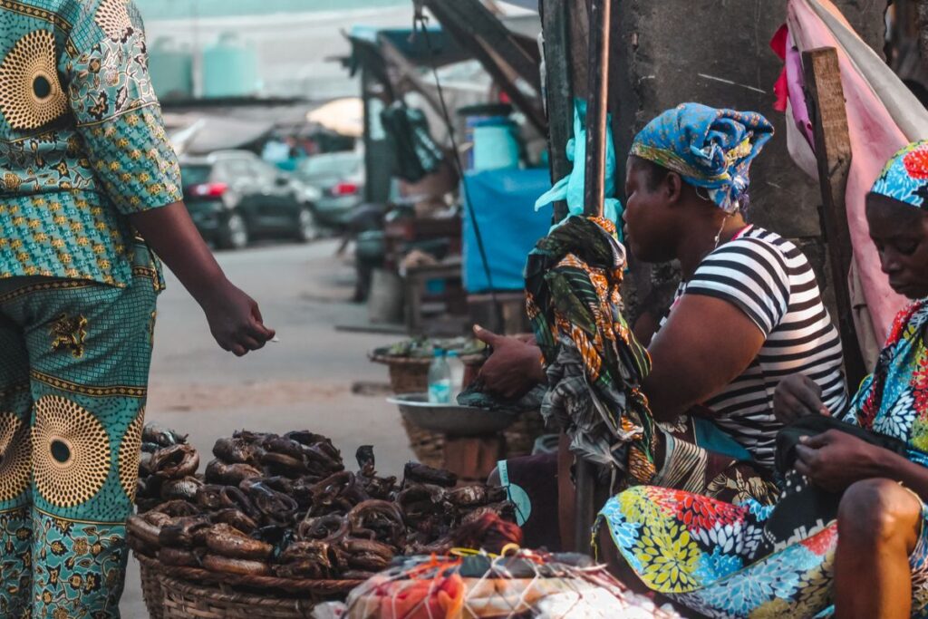 Woman trading goods from a street stall, the kind of early-stage business the TEF grant funds