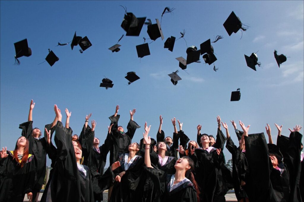 Graduation cap and diploma representing scholarship award — Rhodes Scholarship fully funded Oxford postgraduate study