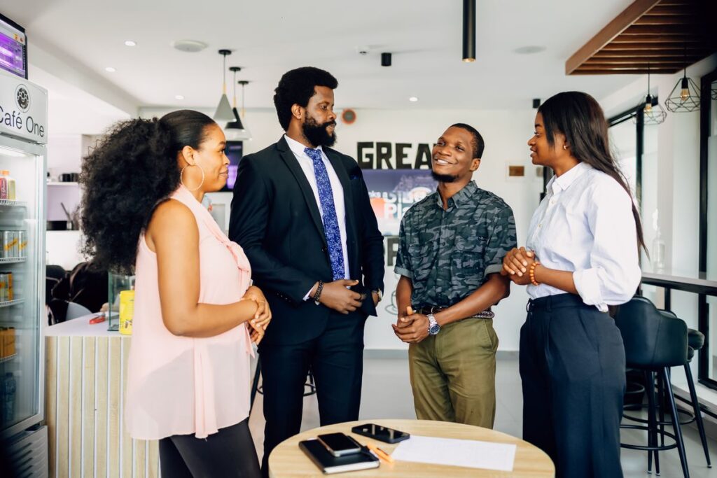Group of professionals in an office meeting, the kind of development role UN fellowships lead to