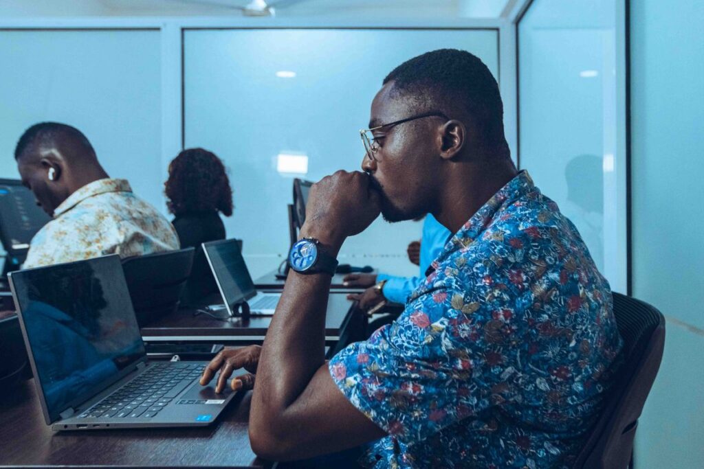 Students in an IT workshop in Accra, Ghana learning coding and software development