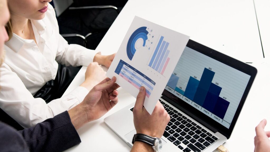 Professional reviewing CV documents and making notes — international CV format tips for visa sponsored job applications